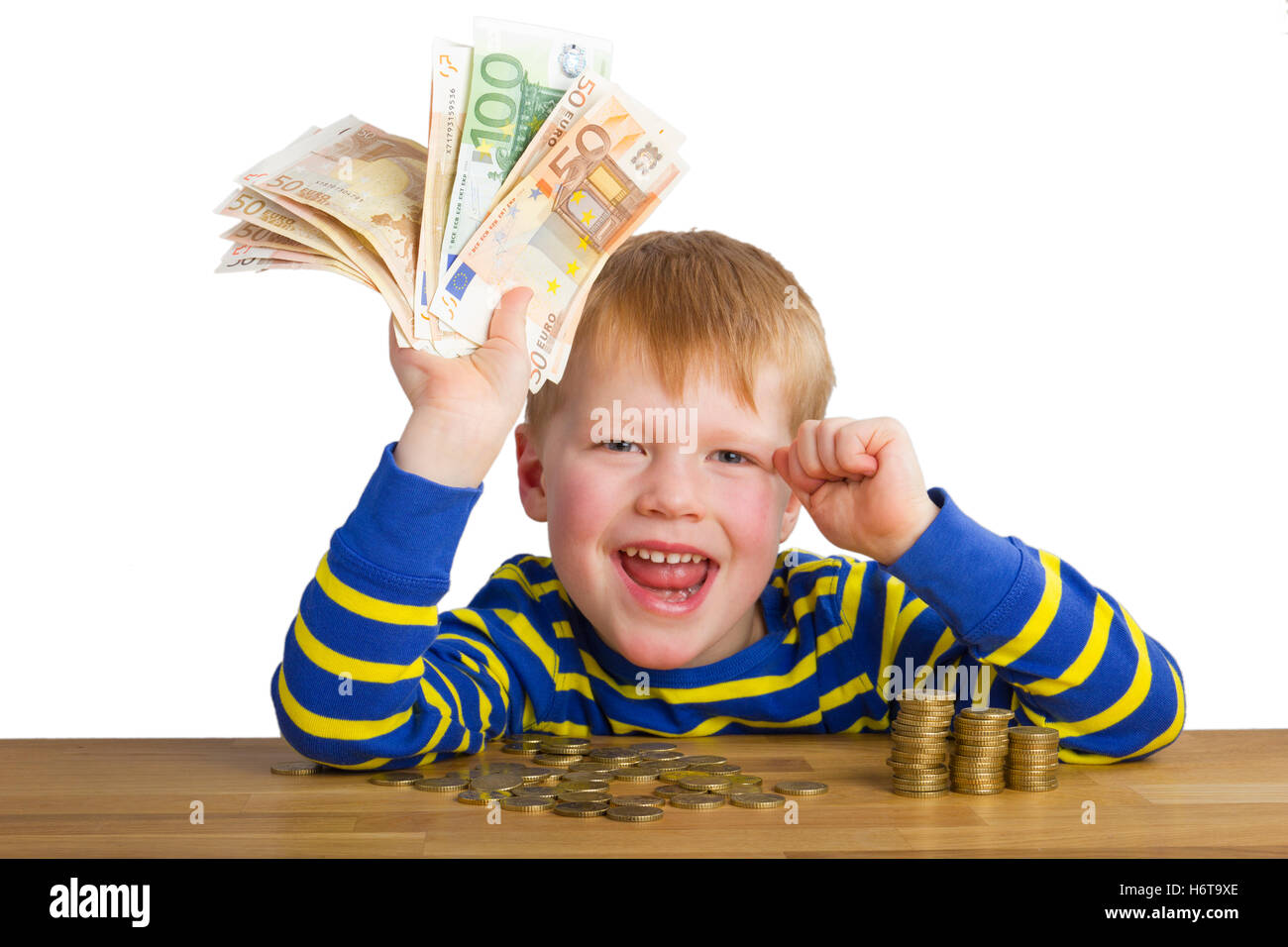 jubilant boy with money Stock Photo