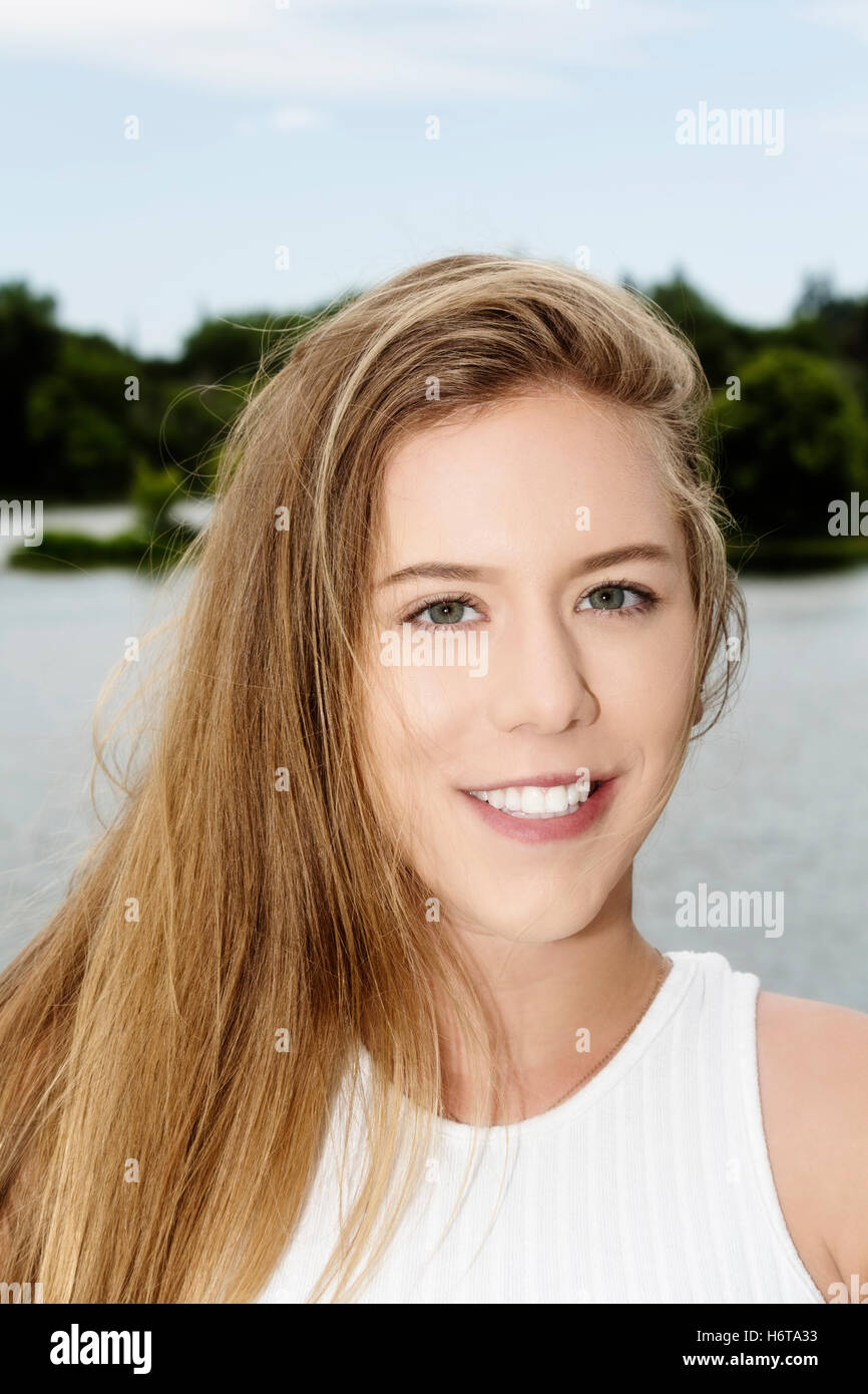 Smiling Attractive Caucasian Teen Woman Outdoor Portrait At River Stock Photo