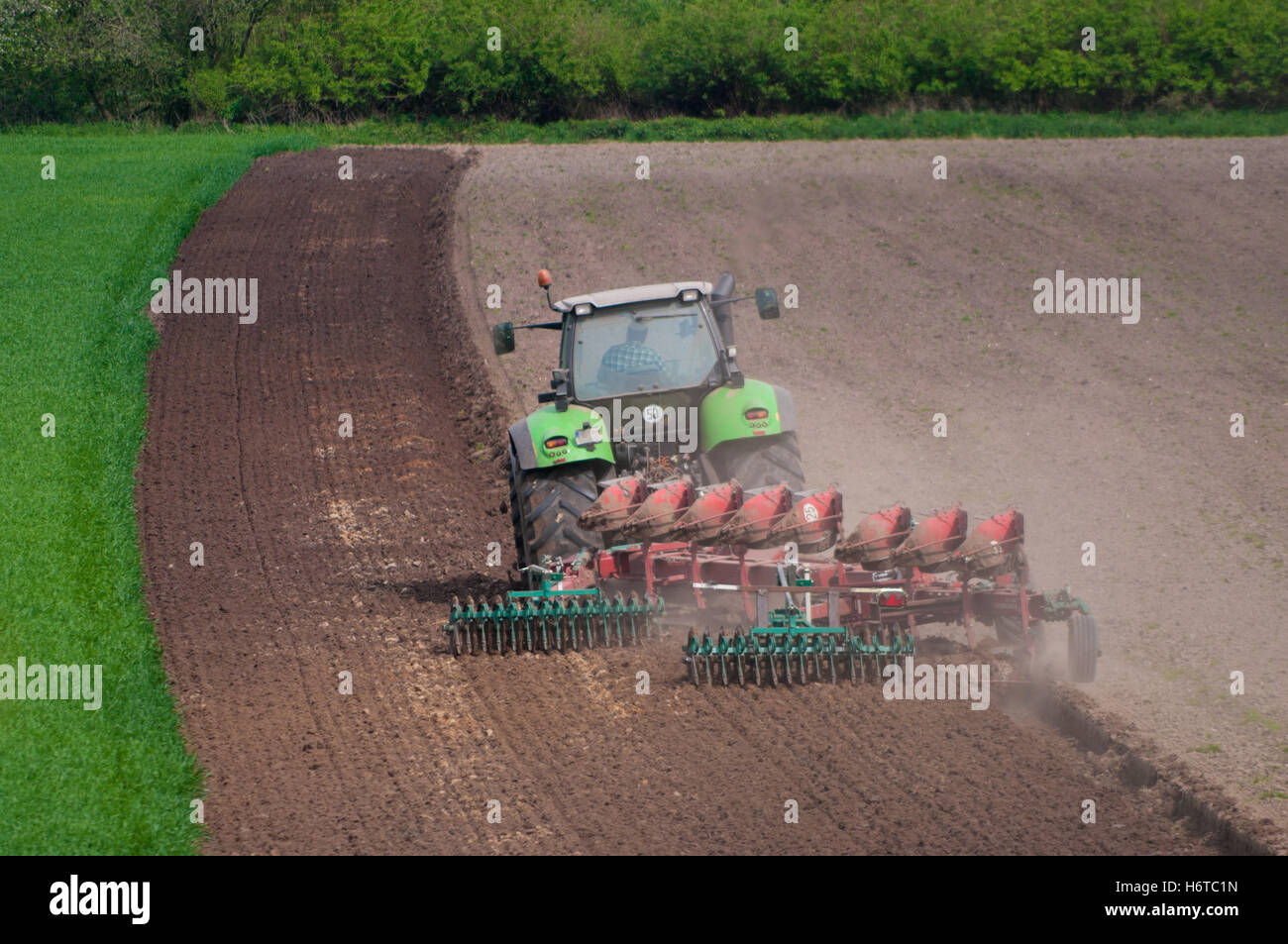 agriculture farming field farm tractor plowing agricultural single wheel machinery traffic transportation ground soil earth Stock Photo