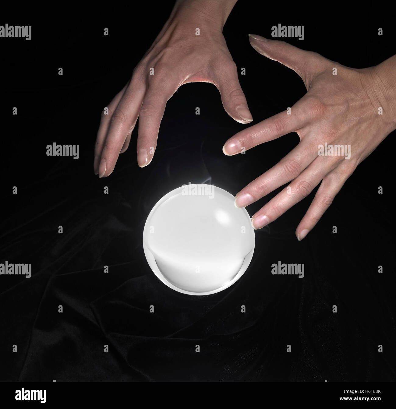 crystal ball and hands around Stock Photo Alamy