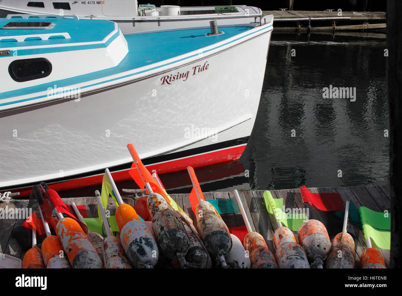 Lobster boat with buoys fishing port industry Portland Harbor Maine New