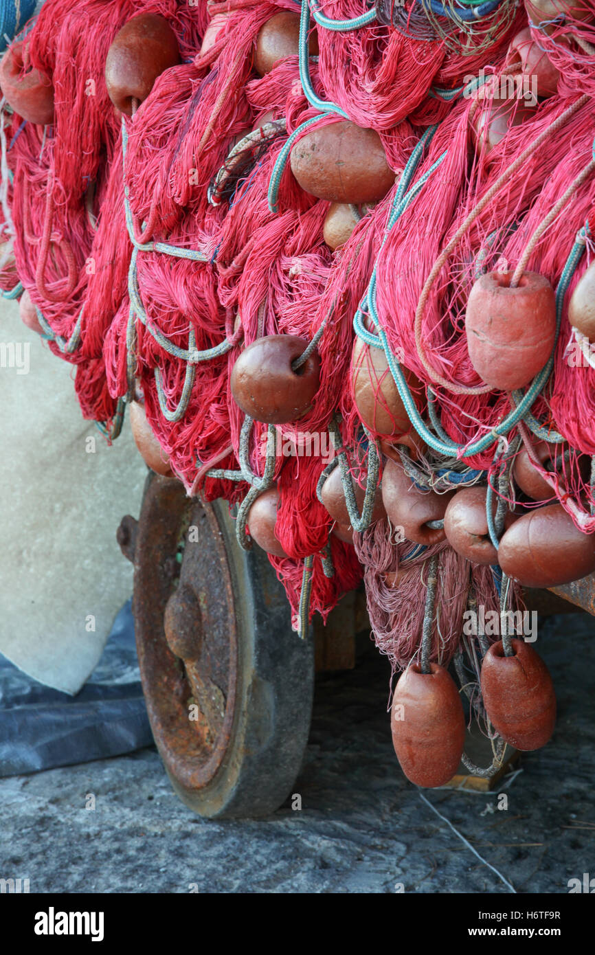 Plastic box full of red white fishing net, huge floats nylon rope used