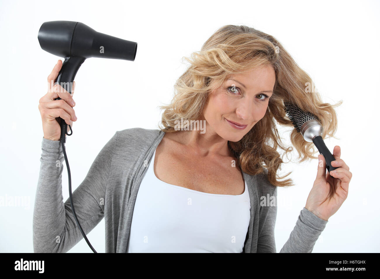 Drying hair hair dryer round hi-res stock photography and images - Alamy