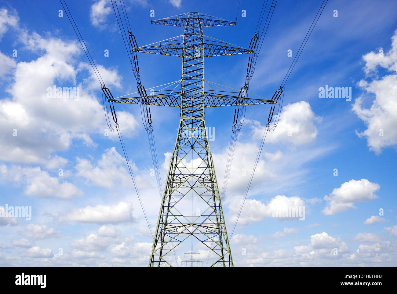blue power station energy power electricity electric power save high tension power line tower high-tension line transmit Stock Photo