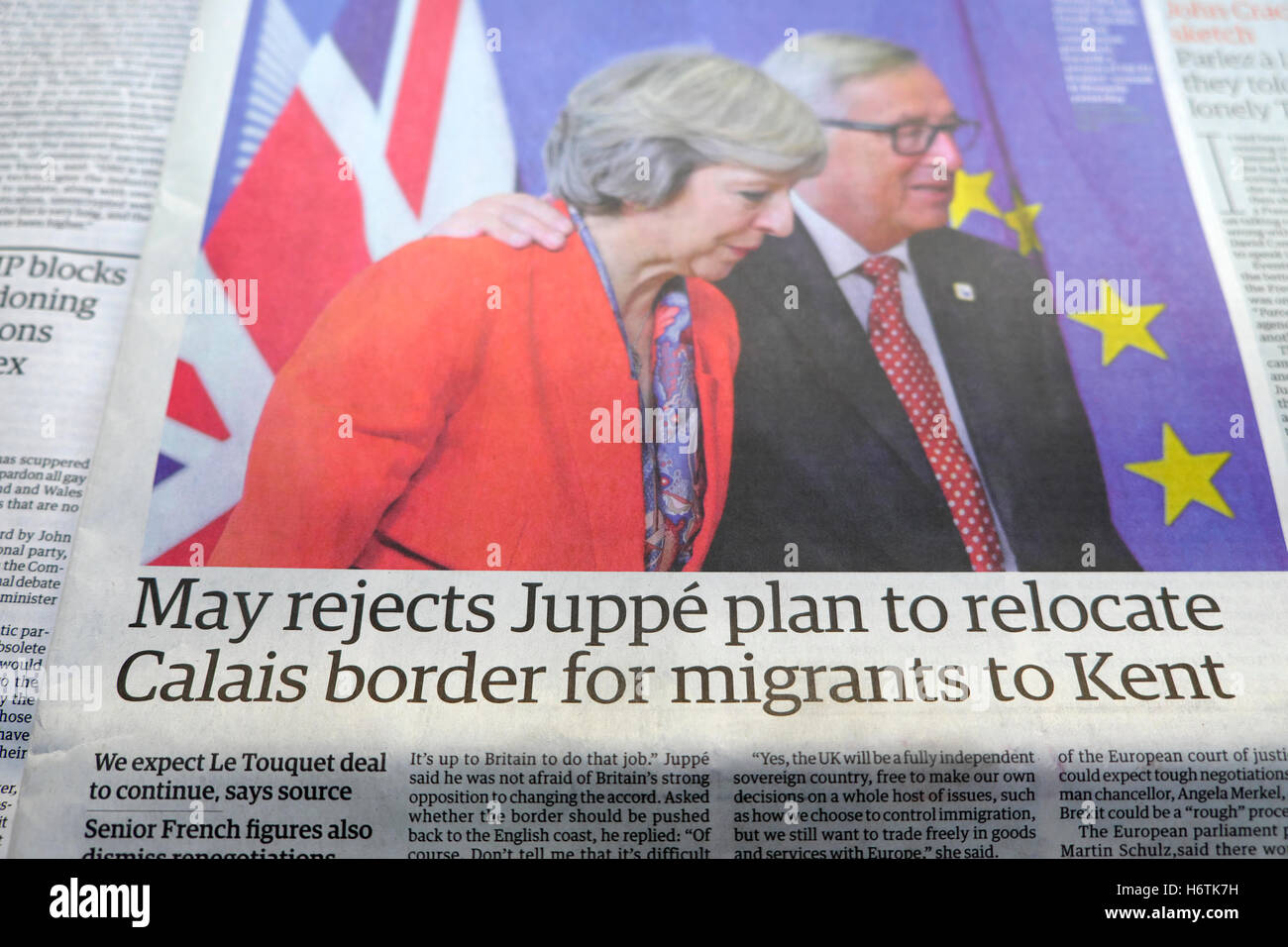 'May rejects Juppé plan to relocate Calais border for migrants to Kent'  Guardian migrant crisis newspaper article in 2016 London England UK Stock Photo