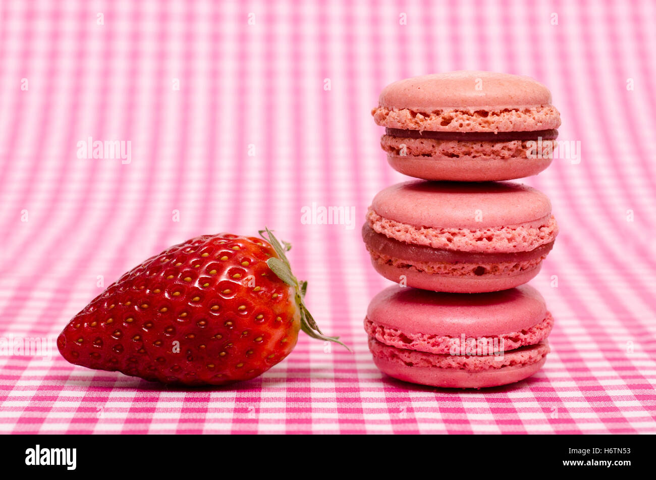 strawberry and three macaron in red Stock Photo