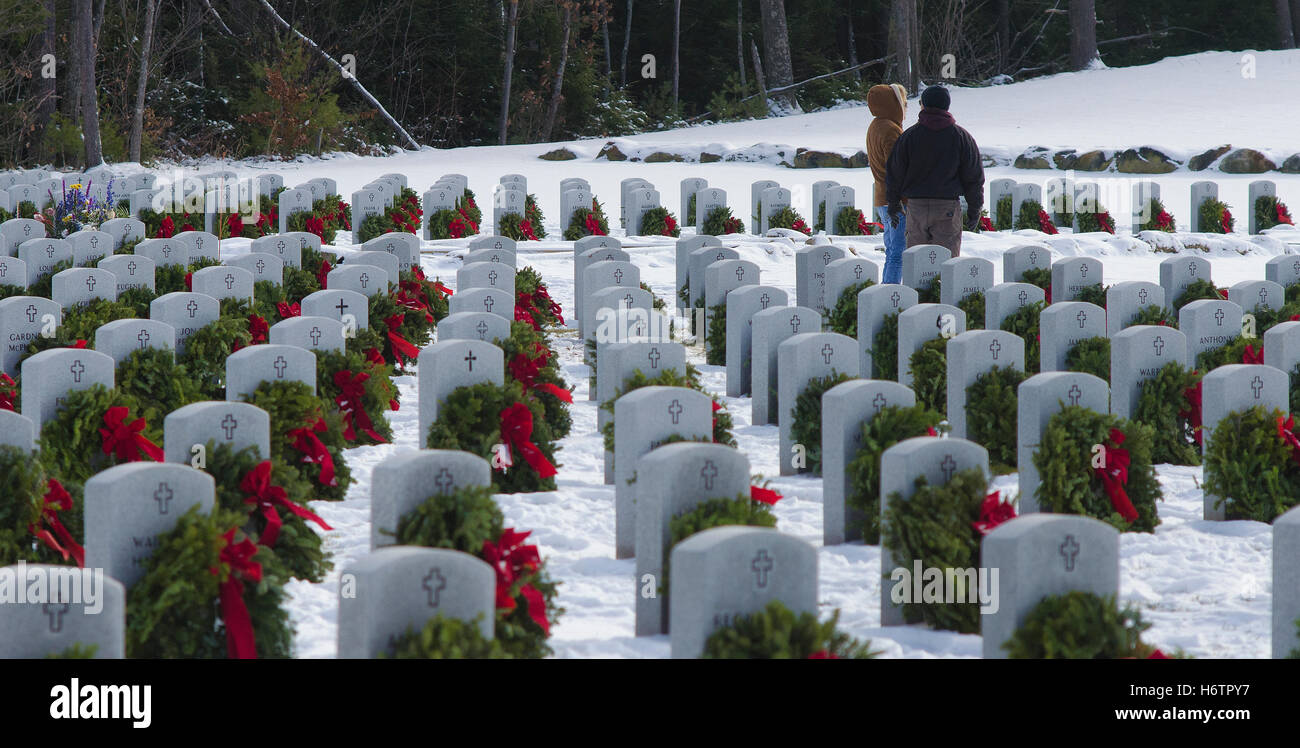 A couple pauses to check out wreaths that adorn headstones at the