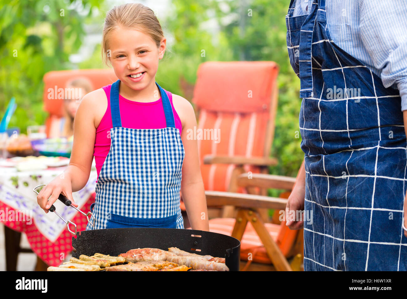 cookout with family in the garden in front of house Stock Photo - Alamy