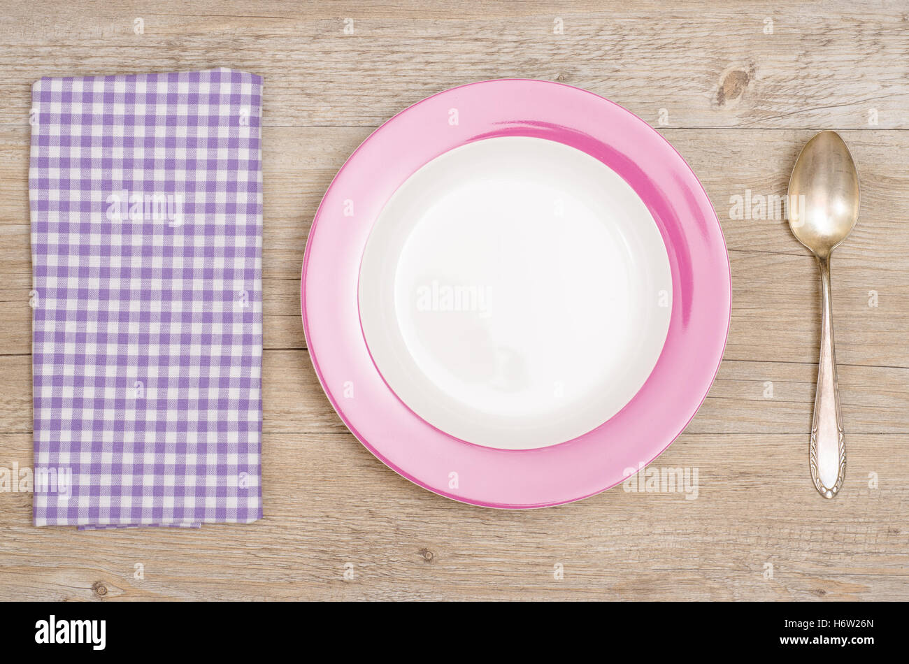 plate,spoon and napkin on wooden Stock Photo