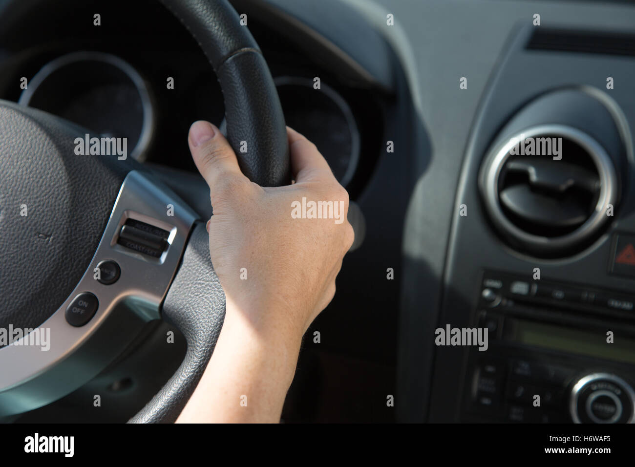 hand on the wheel of a car Stock Photo Alamy