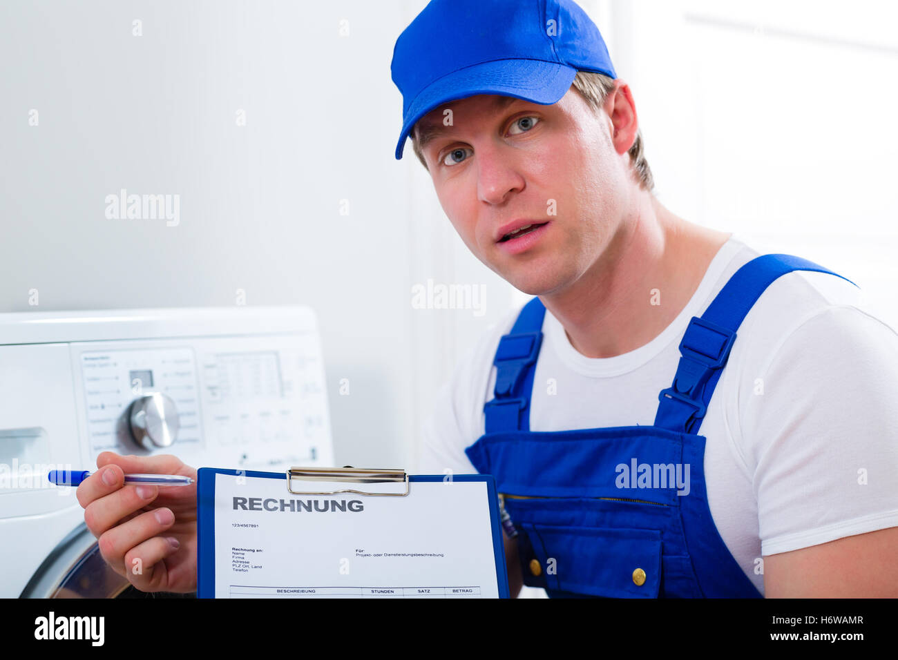 person providing a service service craftsman tradesman handicraftsman expensive invoice plumber humans human beings people folk Stock Photo