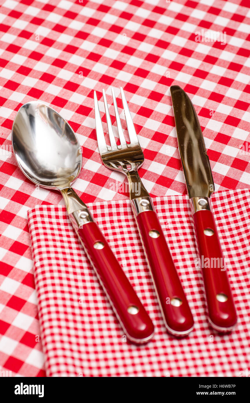 red cutlery in the restaurant on a napkin Stock Photo