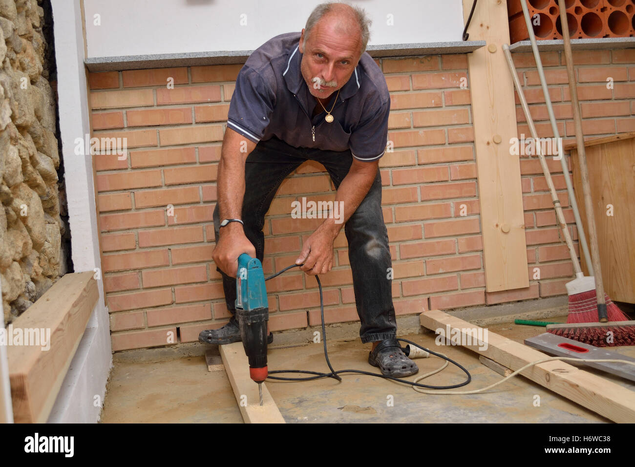 skilled workers during renovation work Stock Photo