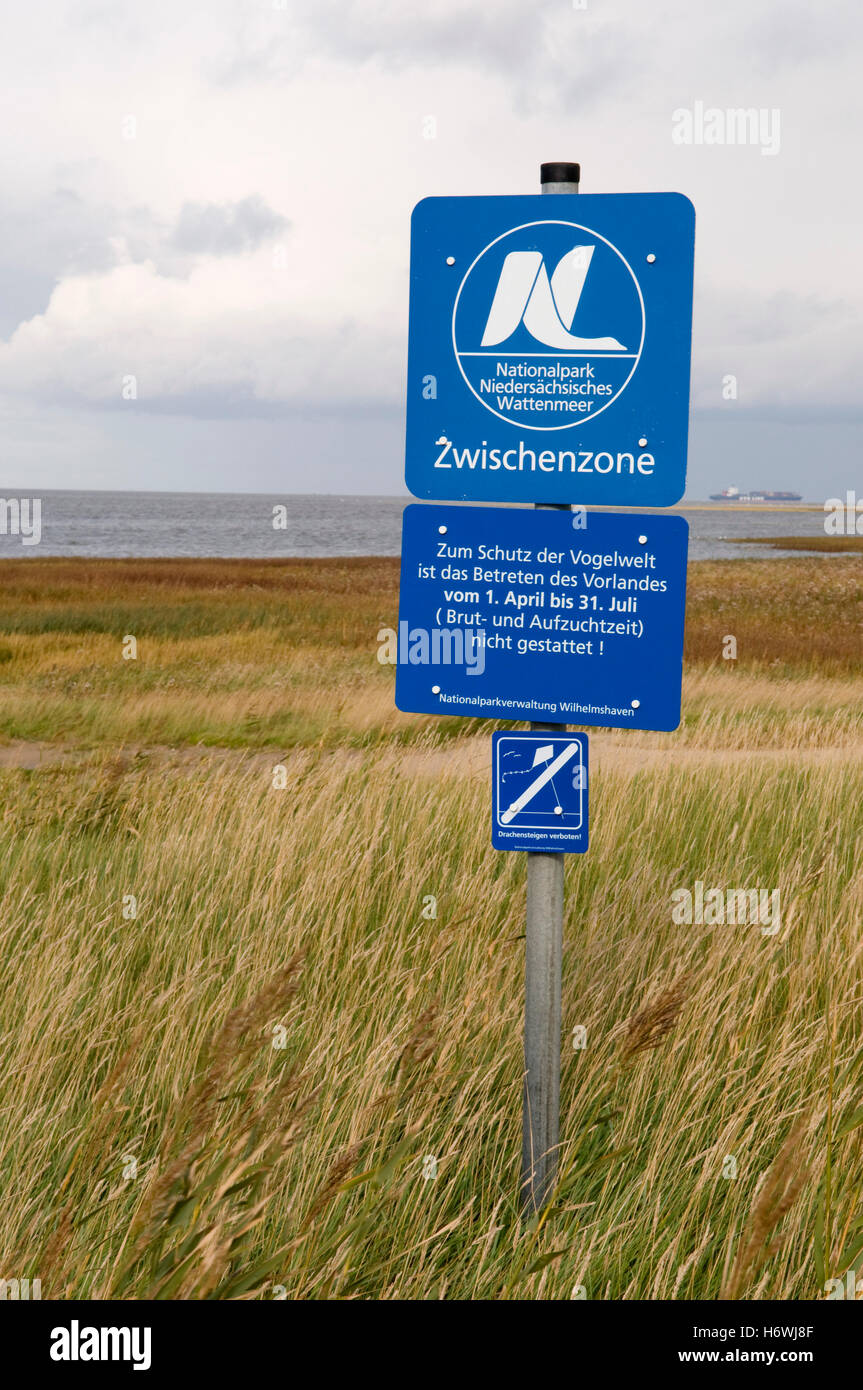 Sign 'Nationalpark Niedersaechsisches Wattenmeer', Lower Saxony Wadden Sea National Park in the salt marshes Stock Photo