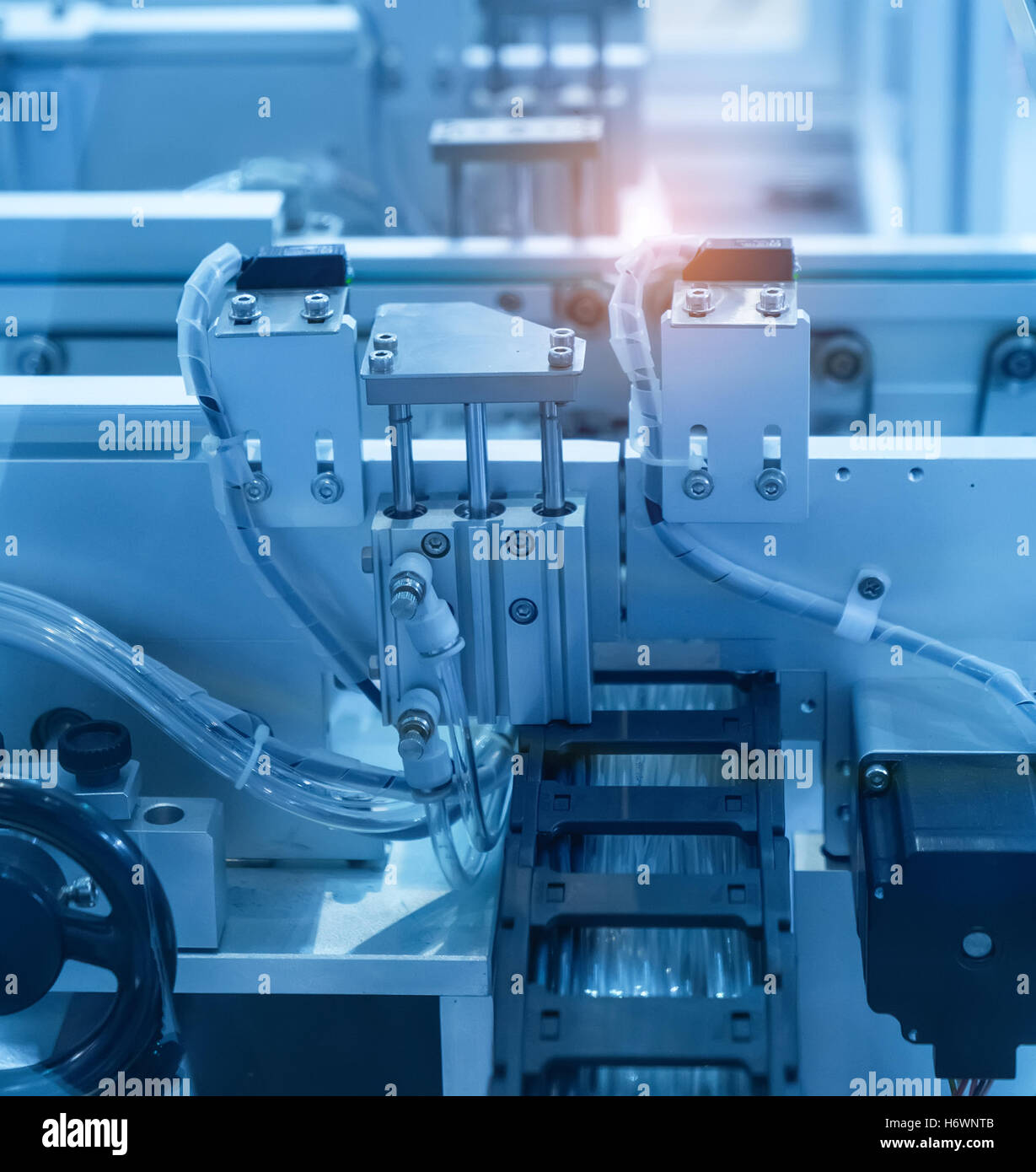 Robotic arm at production line in factory Stock Photo - Alamy