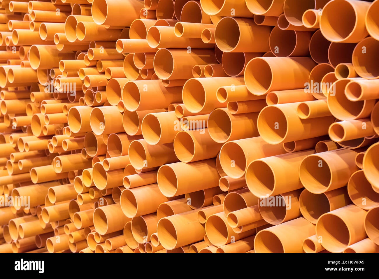 PVC pipes stacked in construction site Stock Photo - Alamy