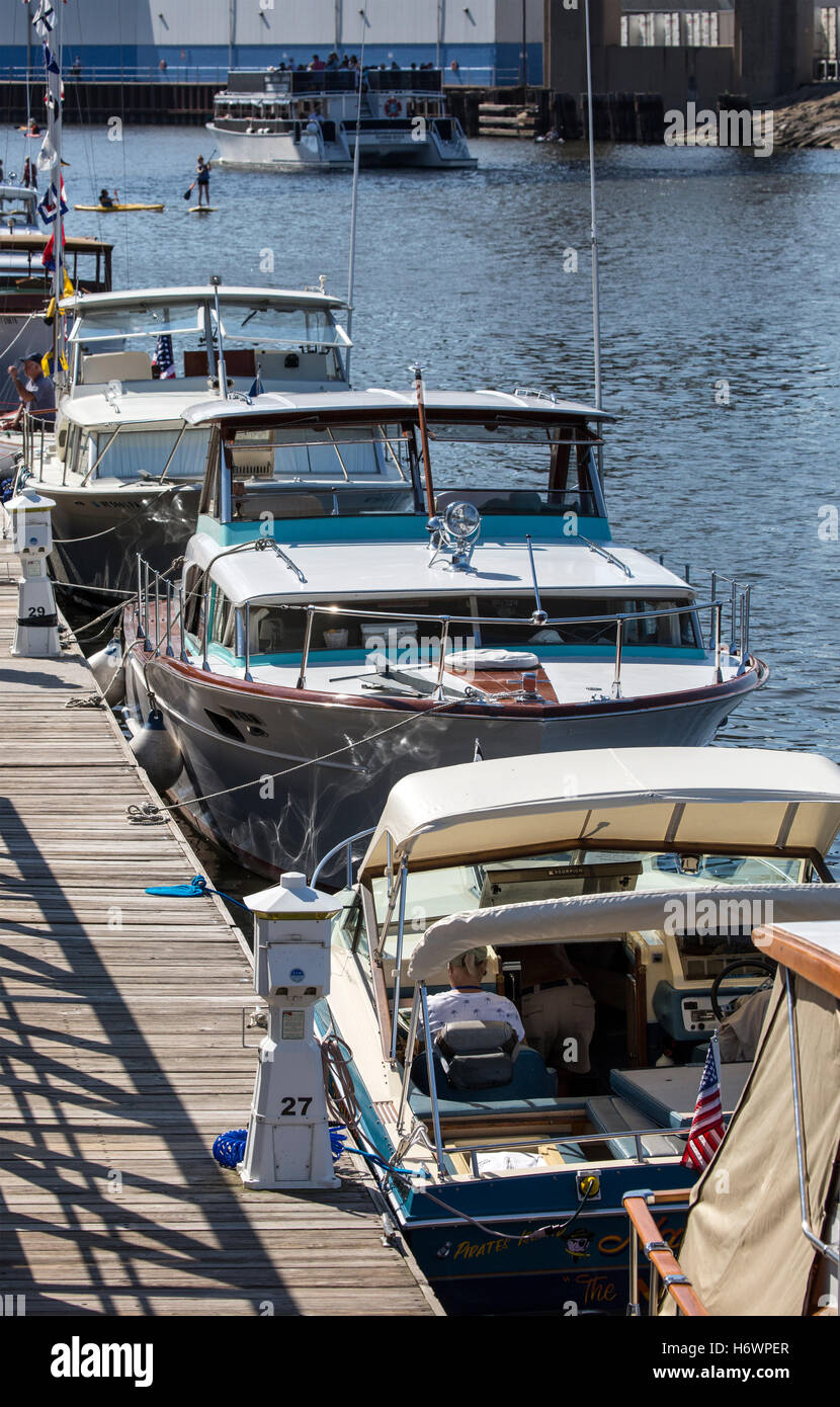 Small, private motorboats docked and on display. Stock Photo