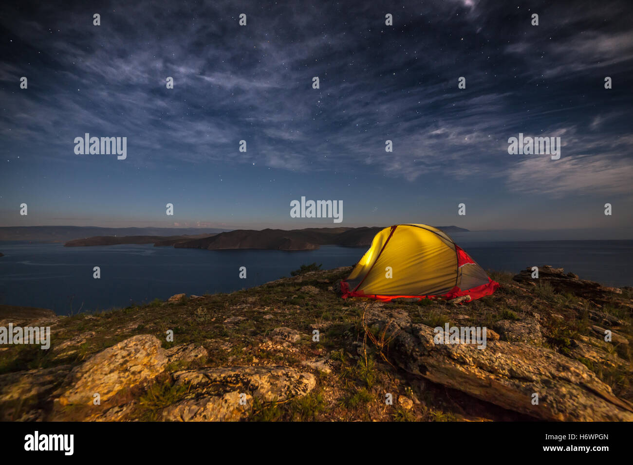 Tent against mountain at night Stock Photo