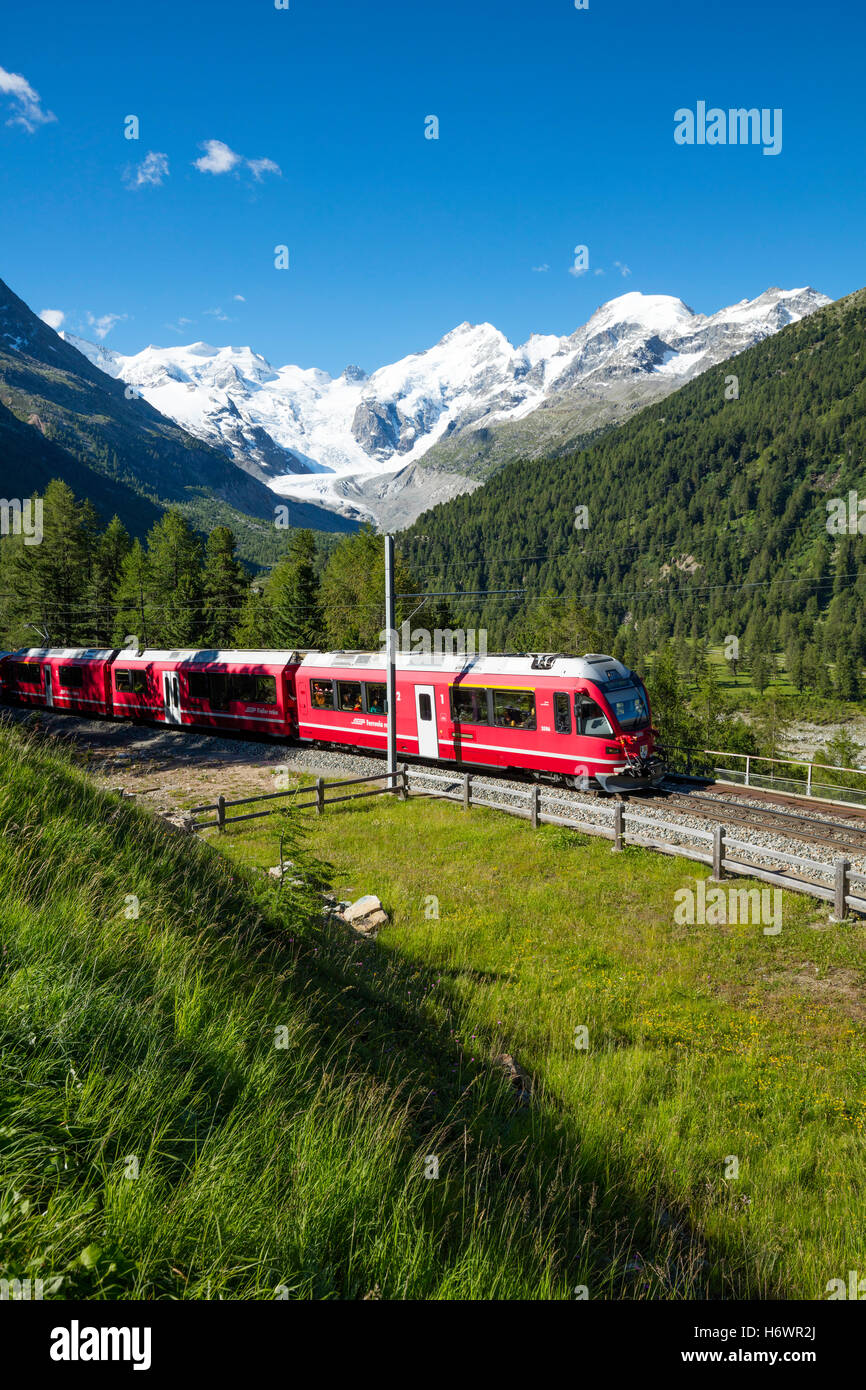 Bernina Express train beneath Morteratsch Glacier. Pontresina, Berniner Alps, Graubunden, Switzerland. Stock Photo