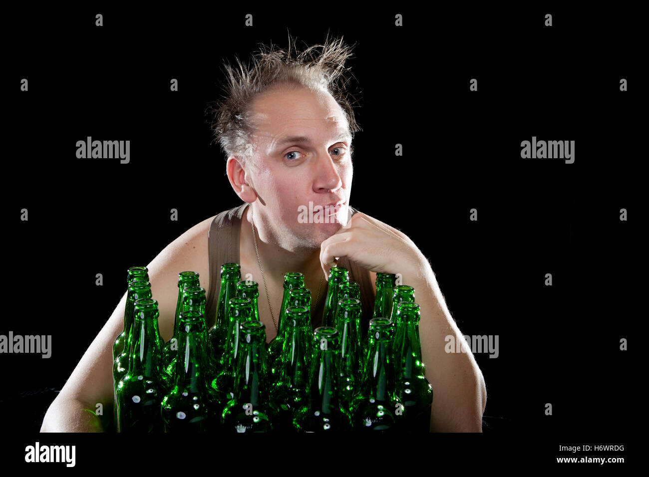The happy tipsy man near empty beer bottles Stock Photo Alamy