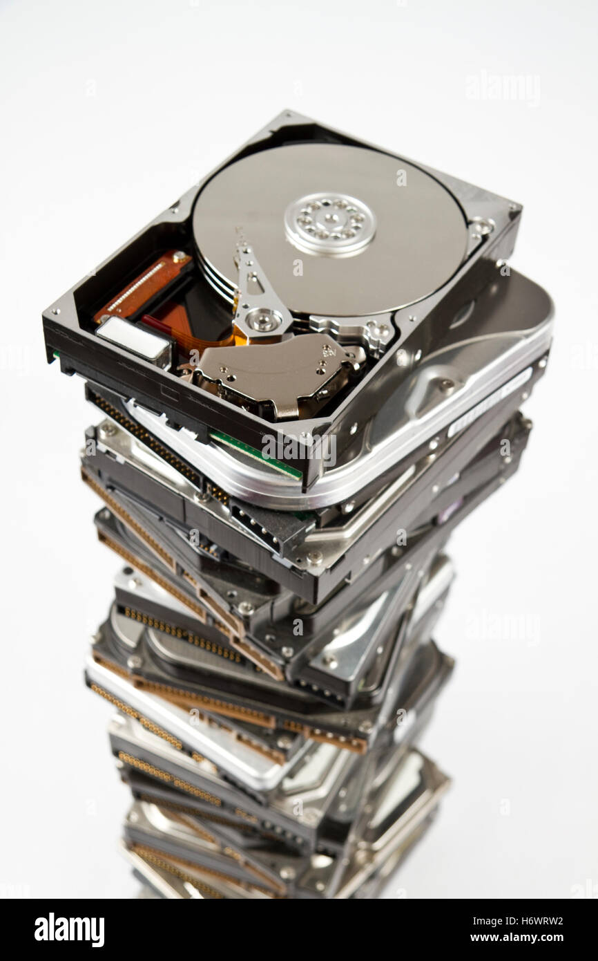 stack of hard drive with opened one on top Stock Photo