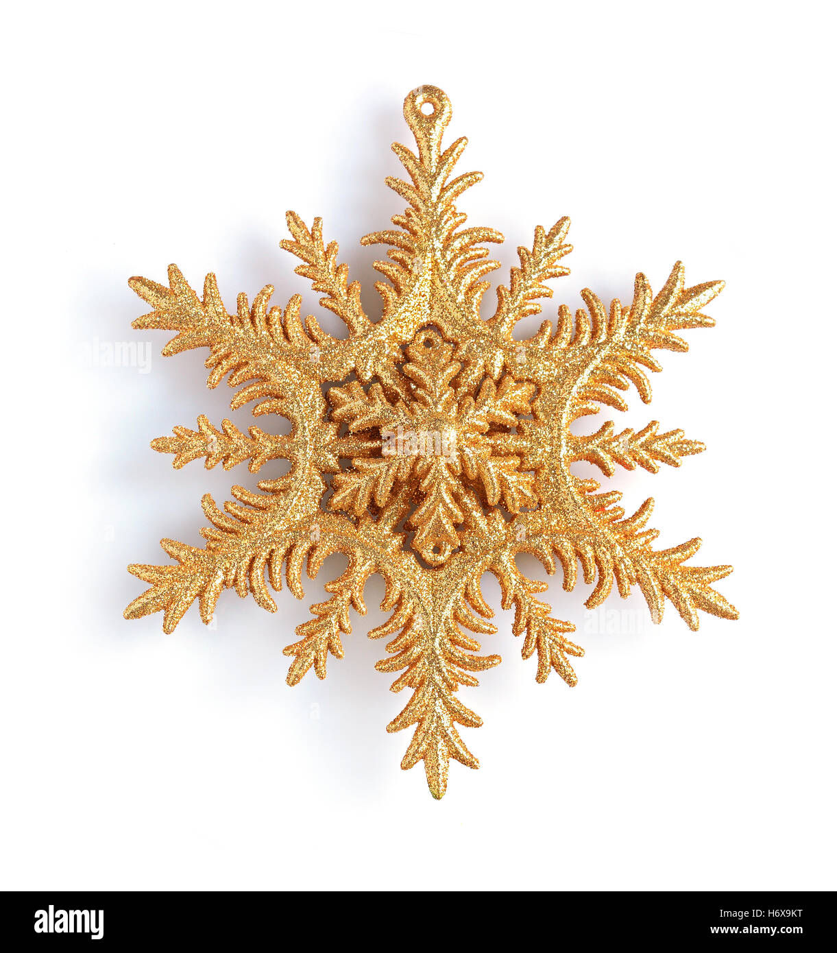 Golden decorative Christmas snowflake isolated on white background ...