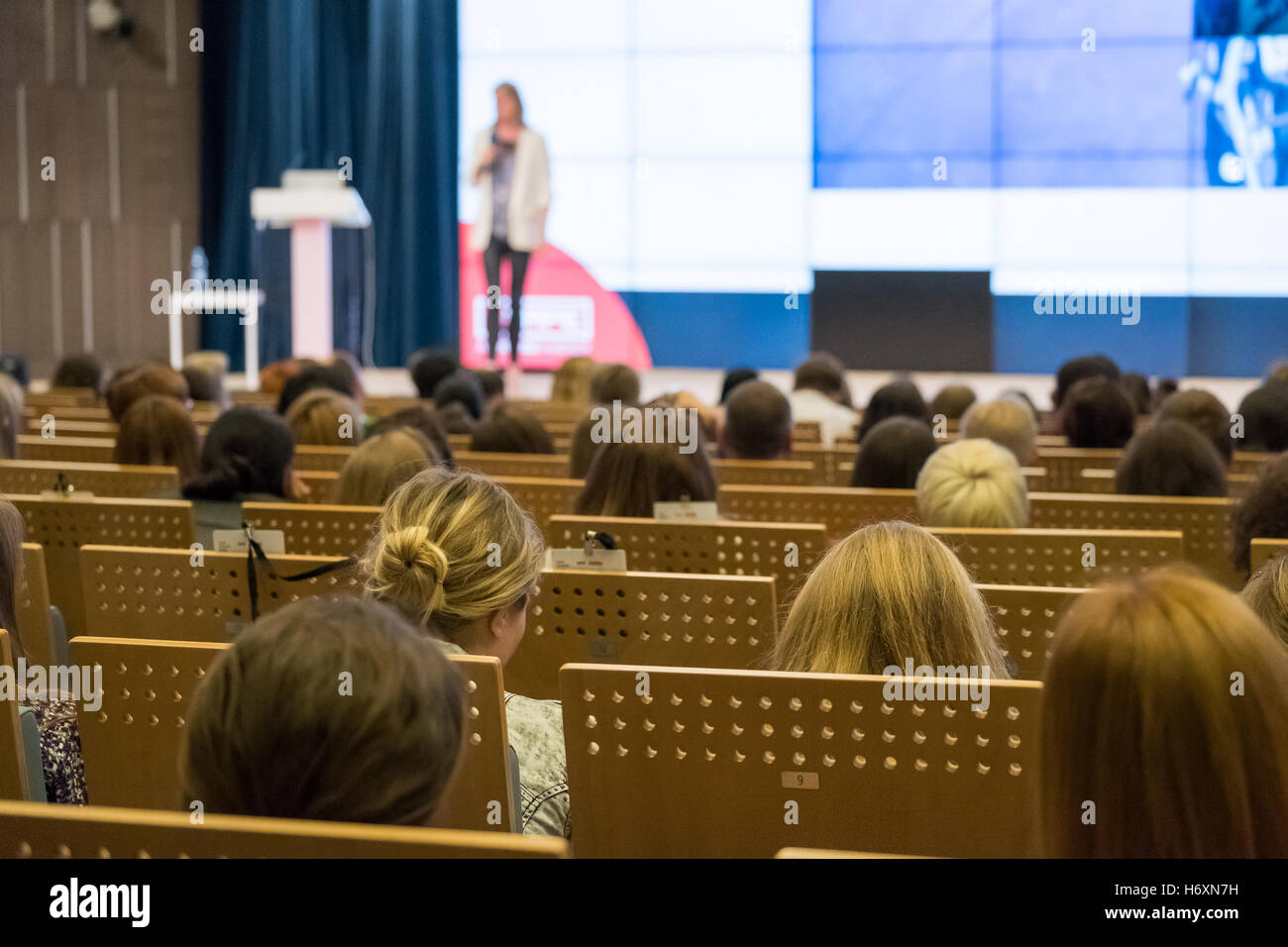 Listening to speaker hi-res stock photography and images - Alamy