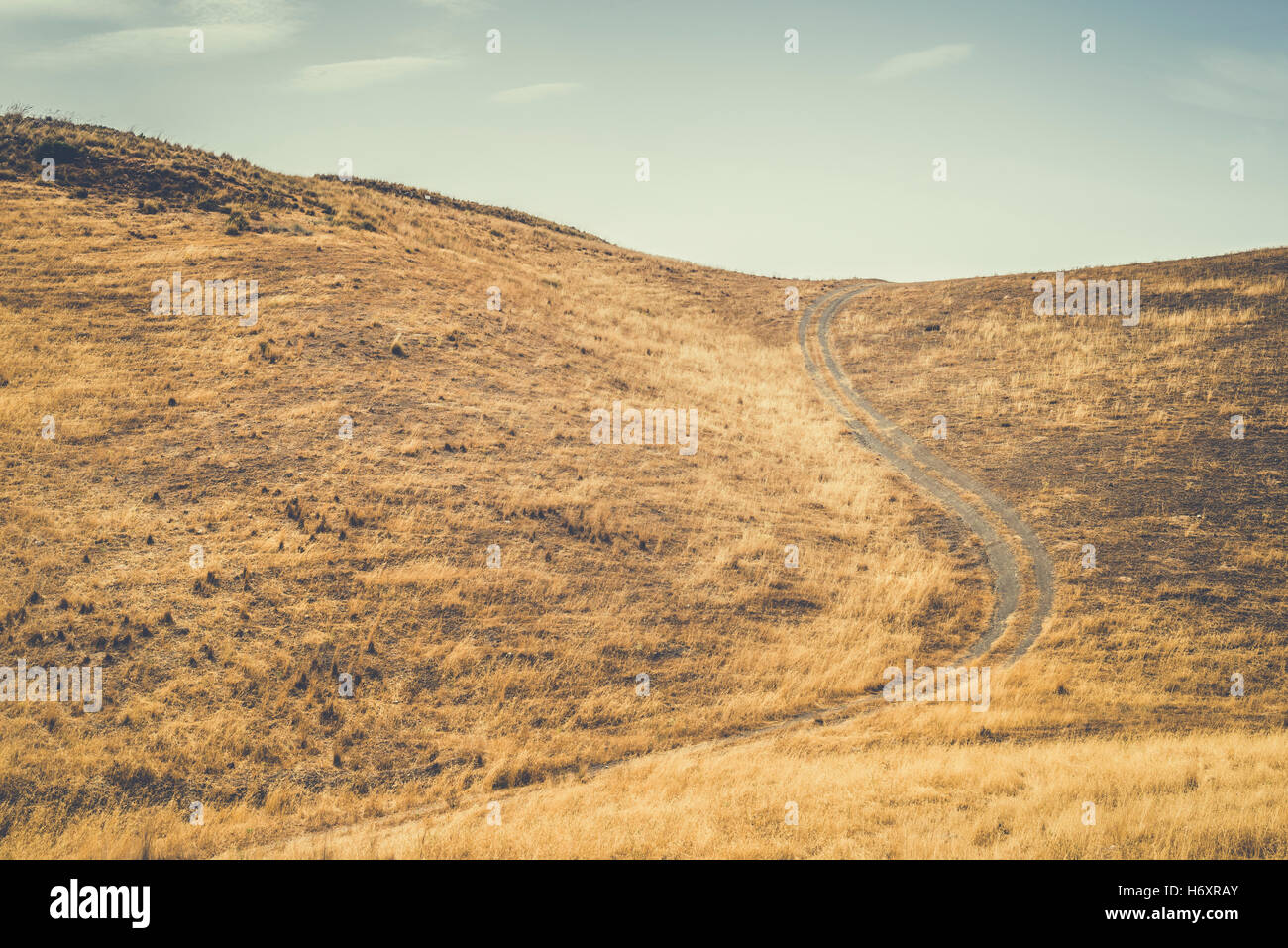 Vintage dirt road and blue sky Stock Photo - Alamy