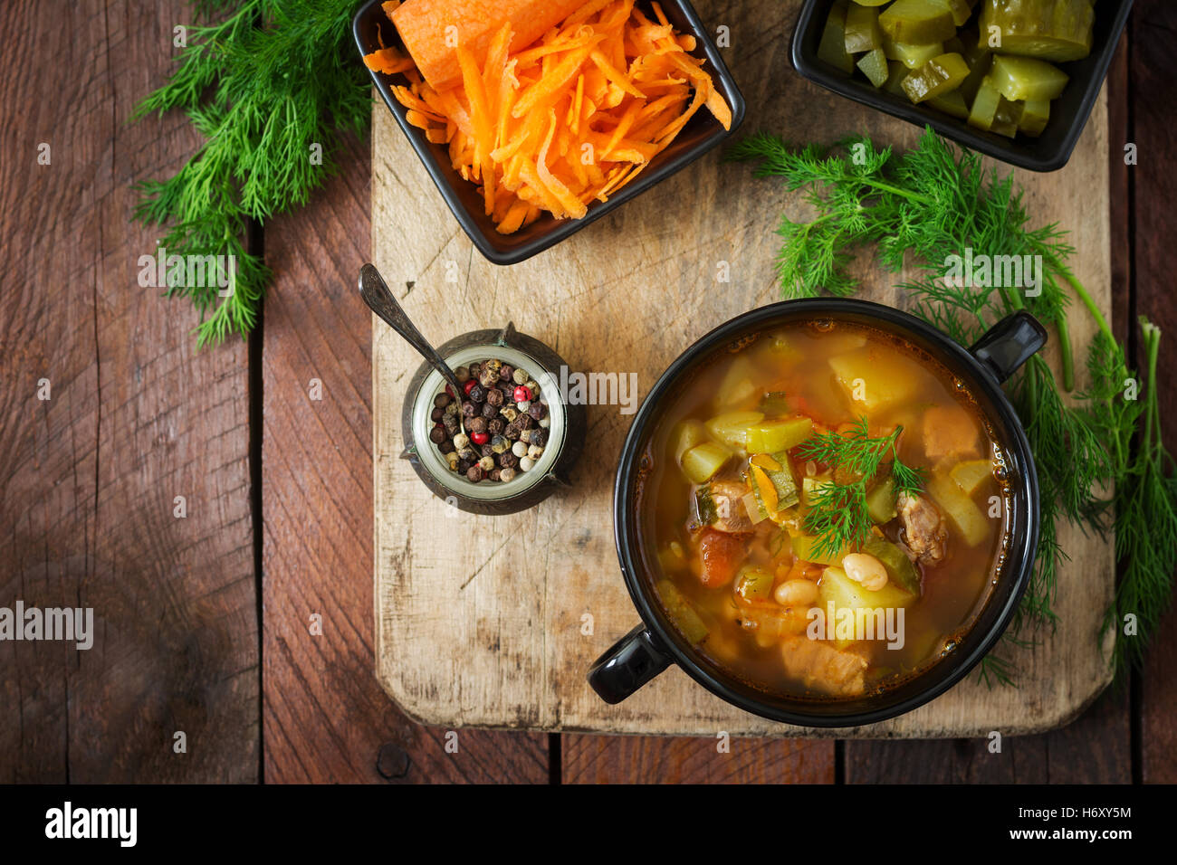 Soup with pickled cucumbers and beans in Ukrainian style. Top view
