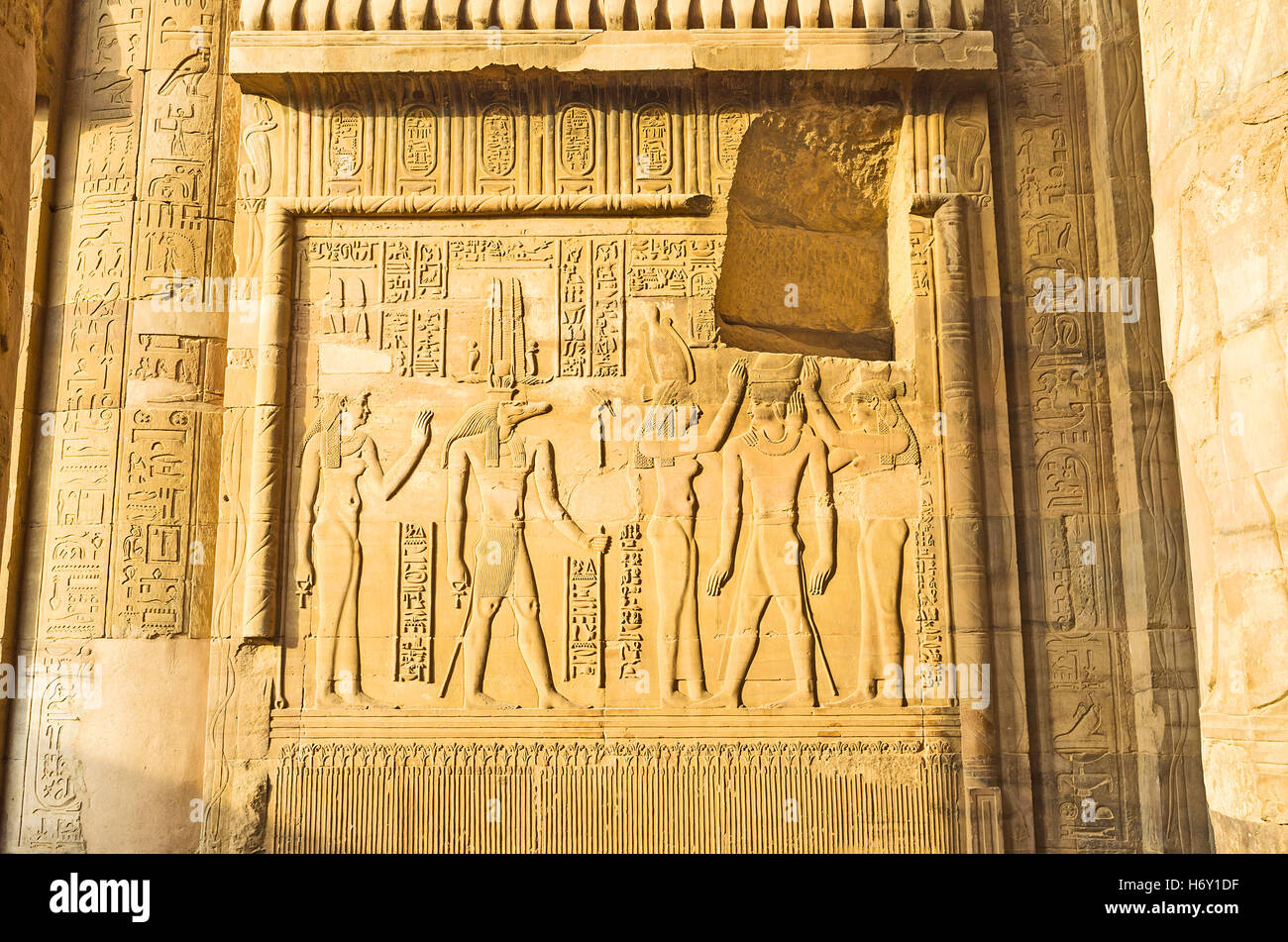 The relief depicts the ceremony of Pharaoh coronation in presence crocodile-headed god Sobek, Kom Ombo Temple, Egypt. Stock Photo