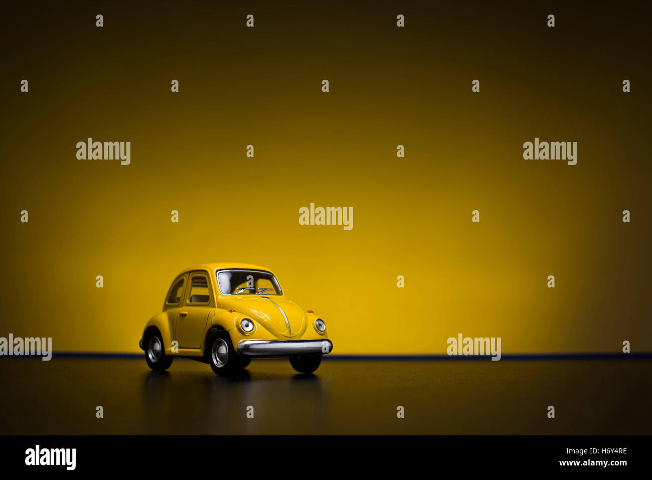 Izmir, Turkey - February 16, 2015. Toy Volkswagen Beetle on yellow background. Stock Photo