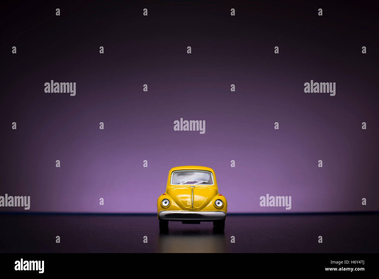Izmir, Turkey - February 16, 2015. Toy Volkswagen Beetle on purple background. Stock Photo