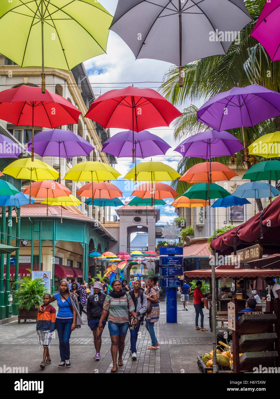 Umbrella art display in street at Caudan Waterfront, Port Luis, Mauritius Stock Photo