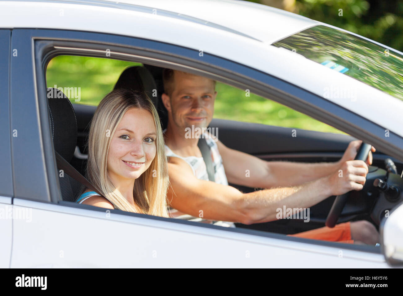 Young happy people enjoying a roadtrip in the car Stock Photo - Alamy