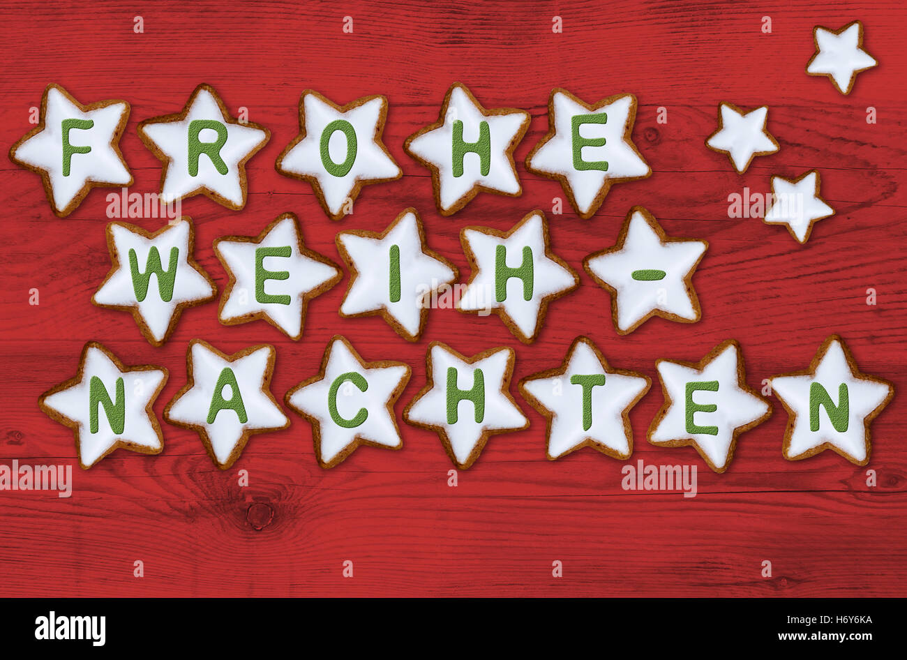 Cinnamon star card frohe weihnachten (in german merry christmas) concept. Stock Photo