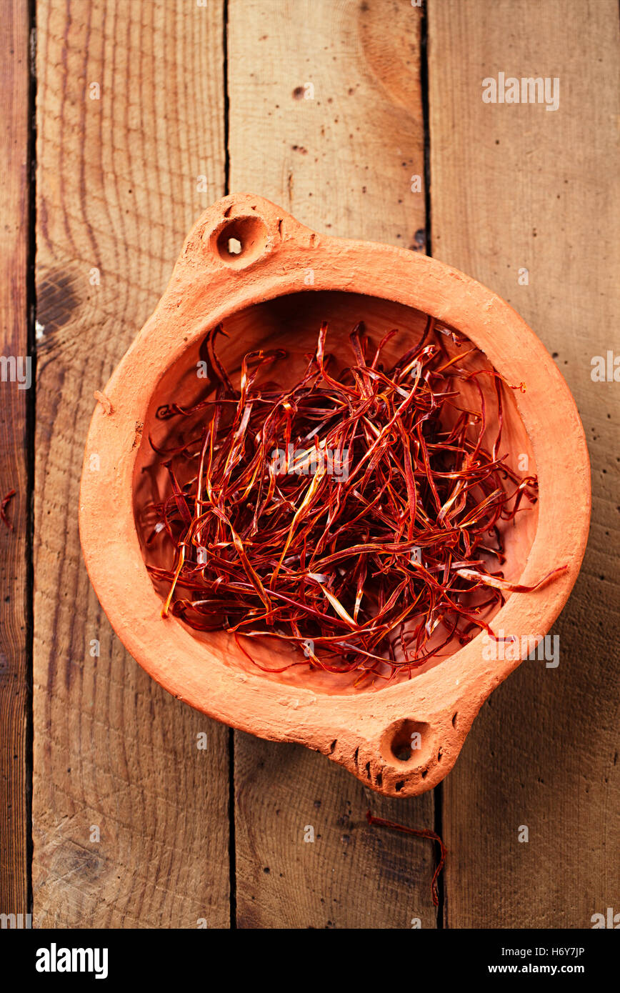 extra hot red chili pepper strings, threads in clay bowl Stock Photo ...