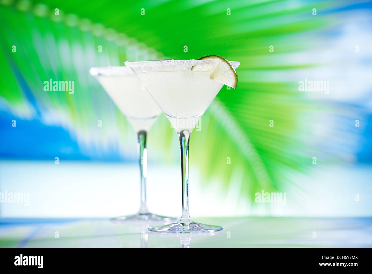 margarita cocktail on beach, blue sea and sky background Stock Photo