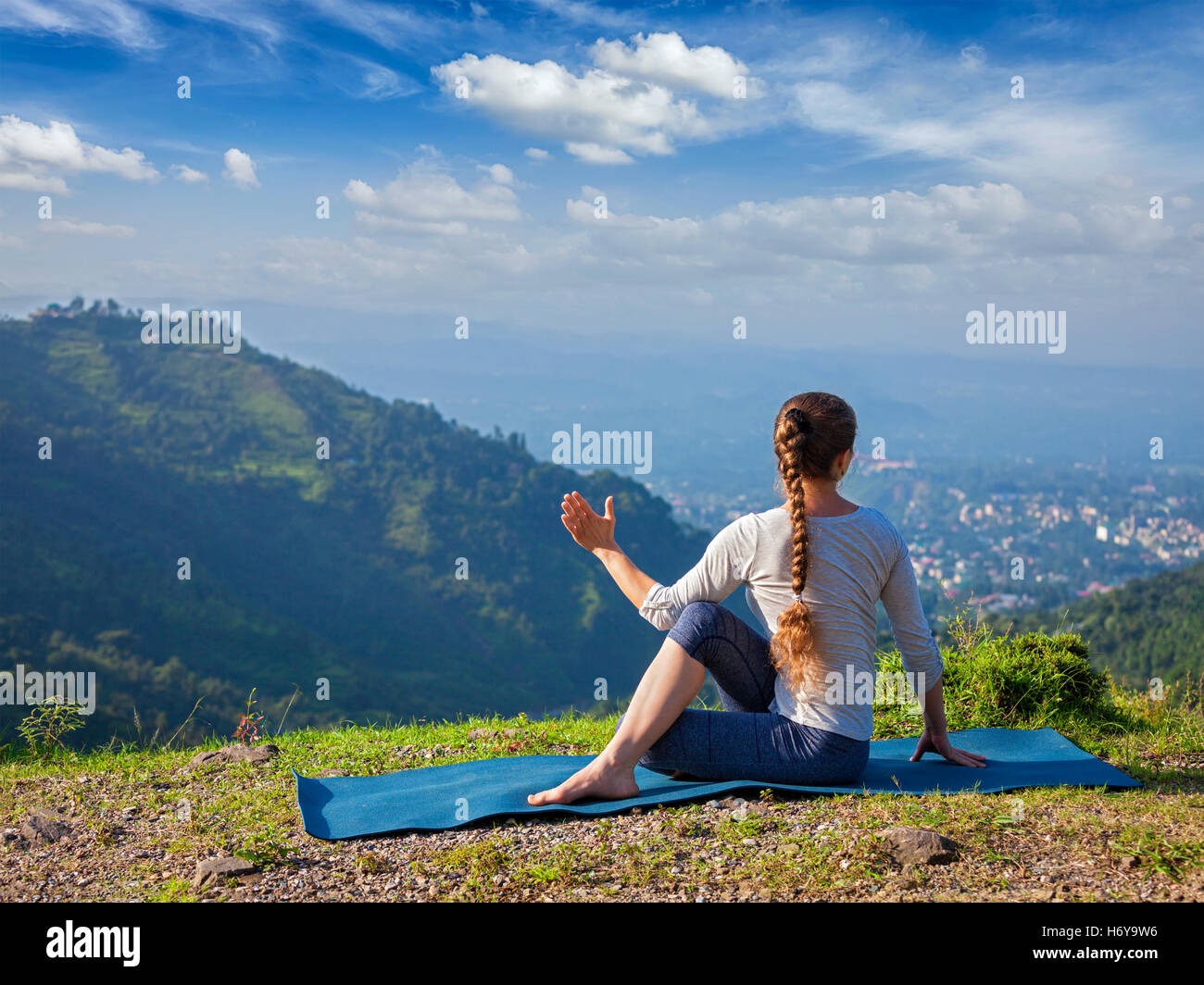 Woman doing Hatha yoga asana outdoors Stock Photo