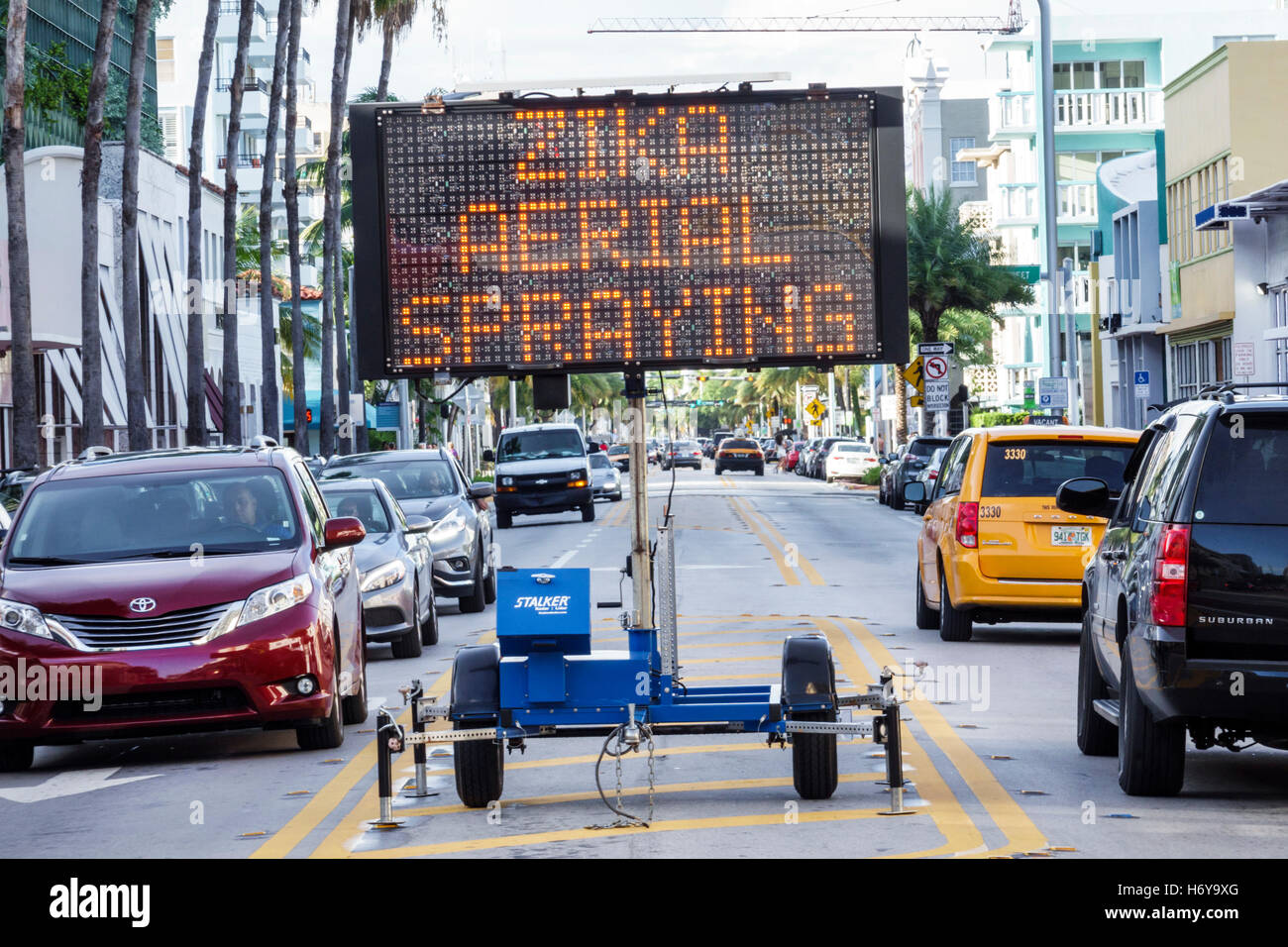 Miami Beach Florida,Collins Avenue,Zika Aerial Spraying,warning,notice,electric sign,FL160912022 Stock Photo