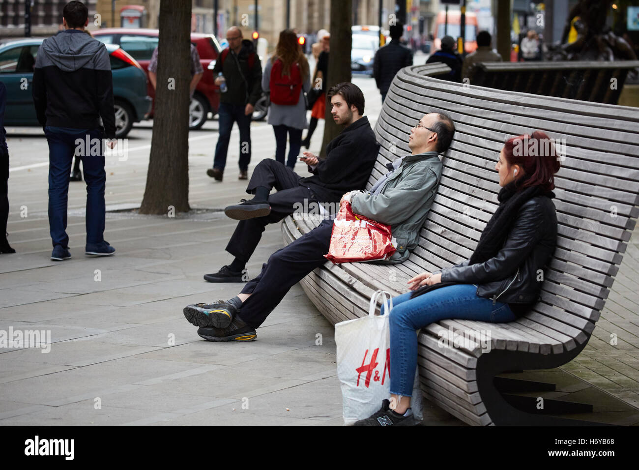Manchester public seating benches modern   Design pretty wood curved resting stopped break relaxed relaxing sat stopped using pu Stock Photo