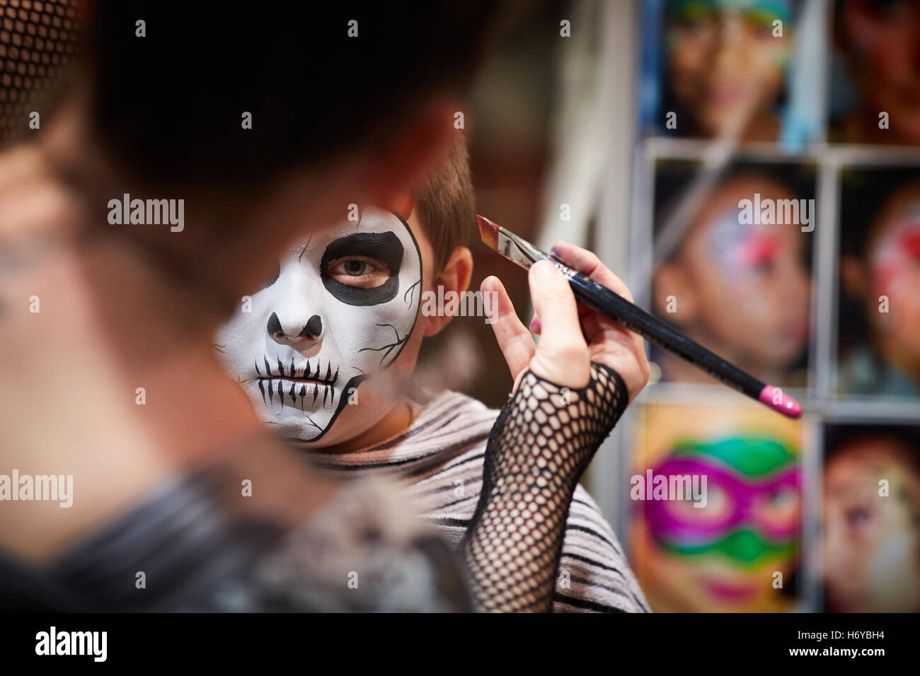 Face painting stall skull   Child boy Artist creative designer designed created hand craft crafted made by  cultural artwork pro Stock Photo