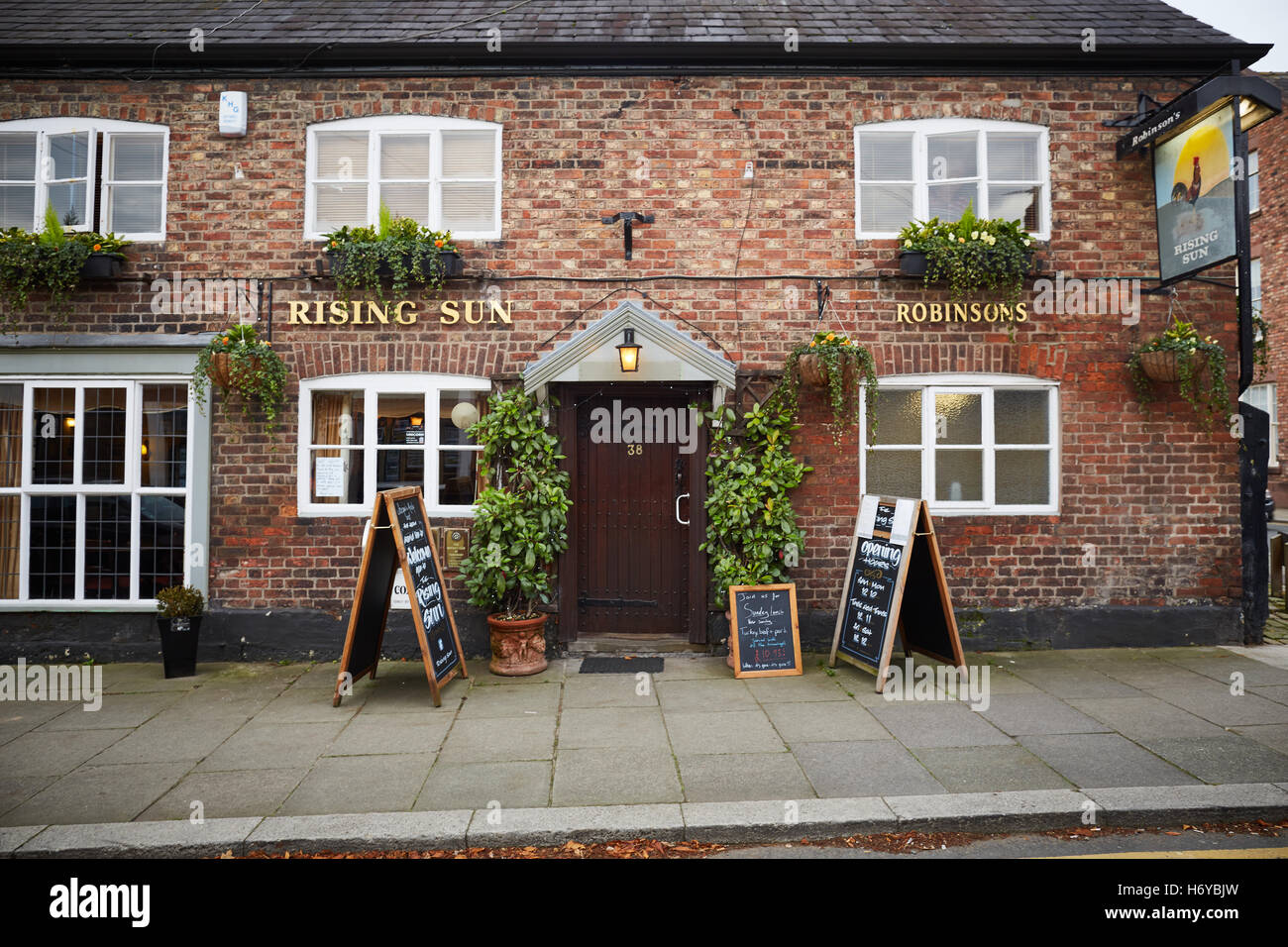Tarporley village cheshire Rising Sun Pub door  picturesque pretty bustling village heart of the Cheshire Quality deluxe luxury Stock Photo