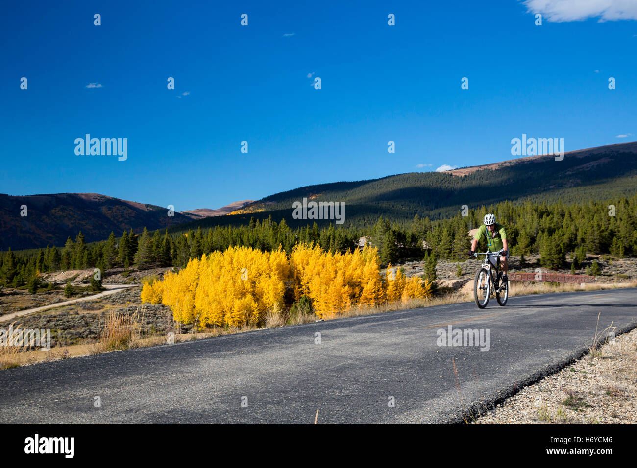 Leadville, Colorado - A bicycle rider on the Mineral Belt Trail, an 11.6 mile non-motorized trail that loops around Leadville. Stock Photo