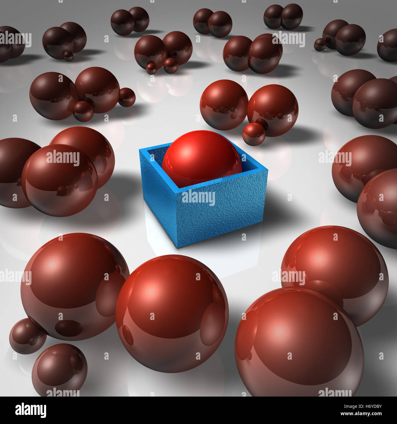 Social isolation abstract concept and lonely individual as a sphere blocked in a cube and separated from society as a psychological feeling of rejection and exclusion as a 3D illustration. Stock Photo