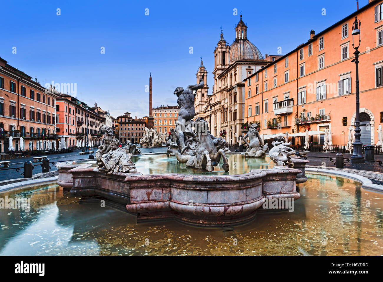 Neptune fountain water and statues in front of St Agnese catholic church at Navona Square in Rome, Italy Stock Photo