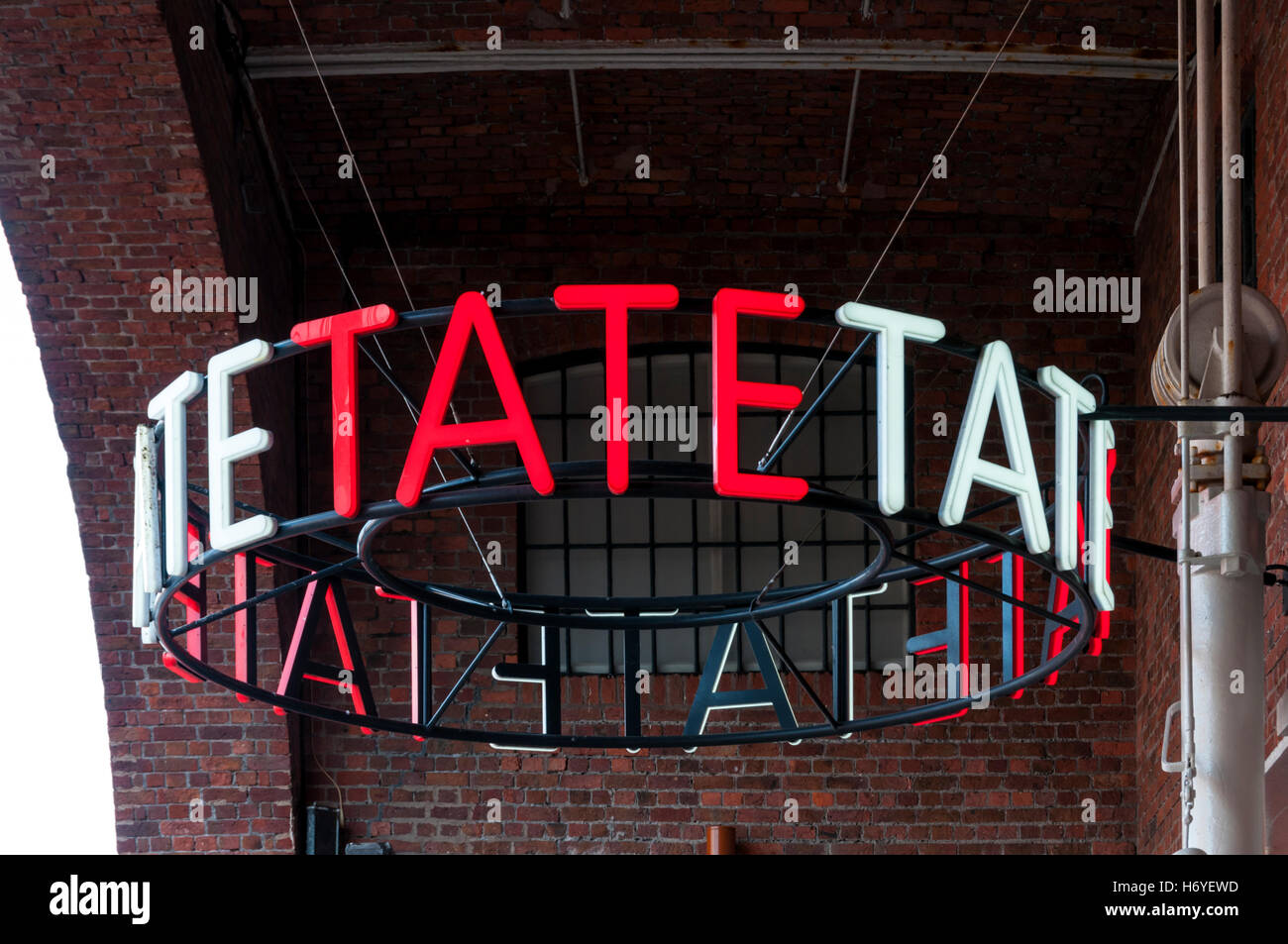 Tate sign outside the gallery in the Albert Dock, Liverpool. Stock Photo