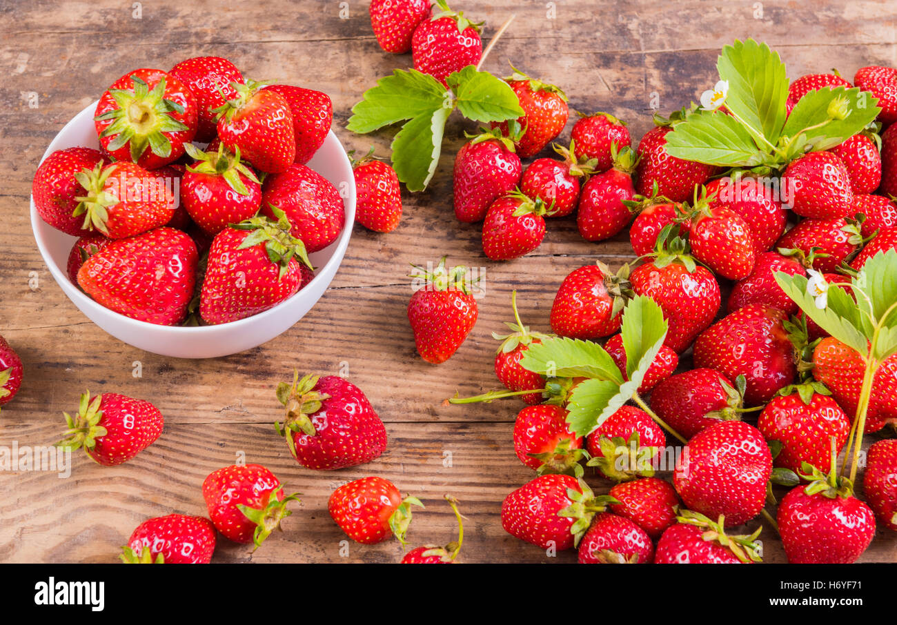 Fresh red strawberry on wood background Stock Photo - Alamy