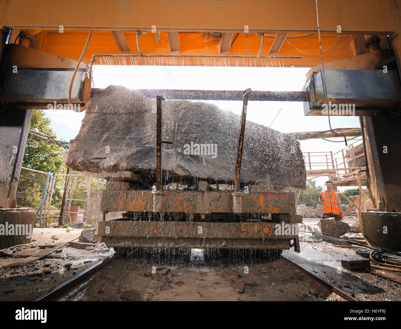 Large rock being cut in stone saw in quarry  Image downloaded by   at 10:33 on the 14/06/15 Stock Photo