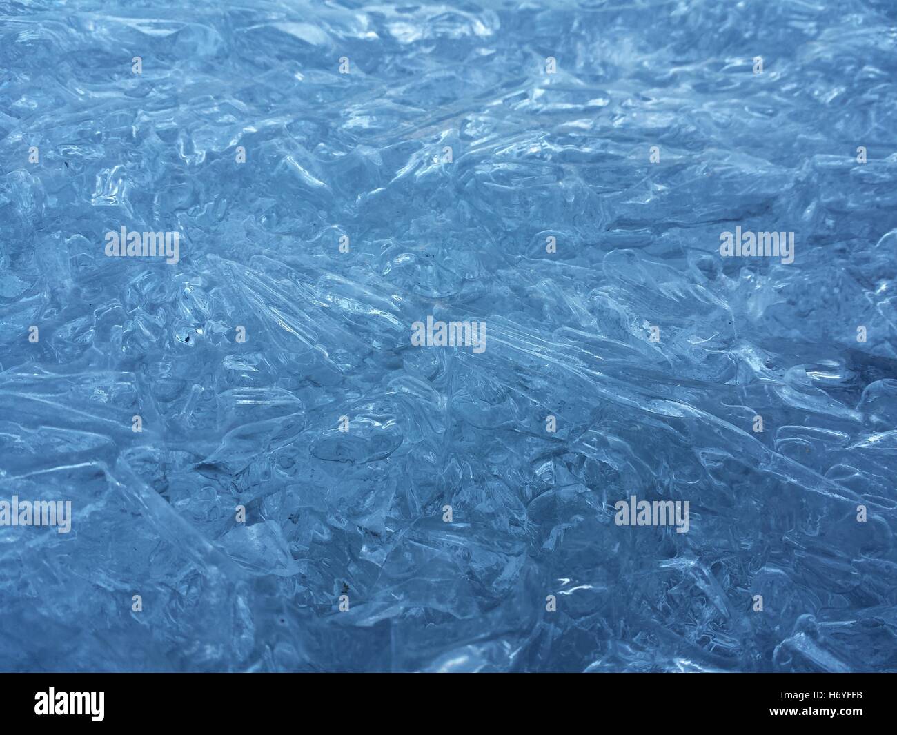 beautiful fresh water blue ice background in northern wilderness Stock