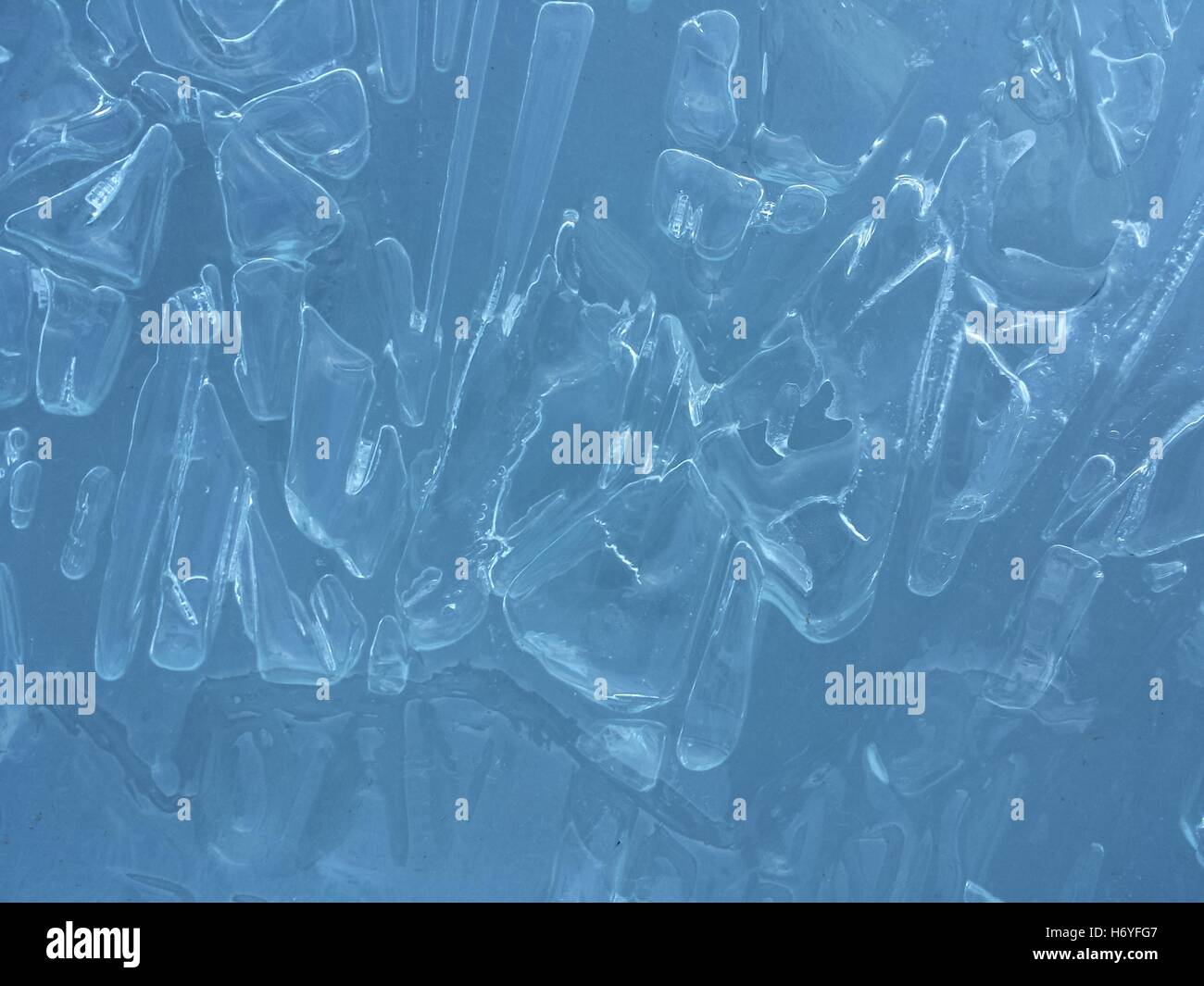 beautiful fresh water blue ice background in northern wilderness Stock